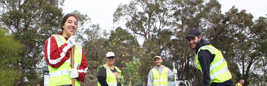 Image of community members planting trees